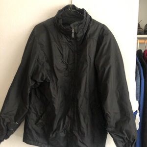 Small black zipper up rain and performance jacket